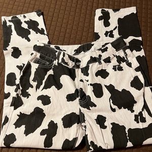 Cow print pants $20, burgundy flare leg $20, black faux leather $20.